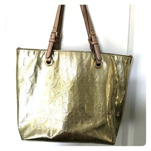 A gold MK embellished shoulder purse